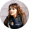 Profile picture of woman with long hair in a police vest