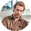 Profile picture of man in a brown shirt